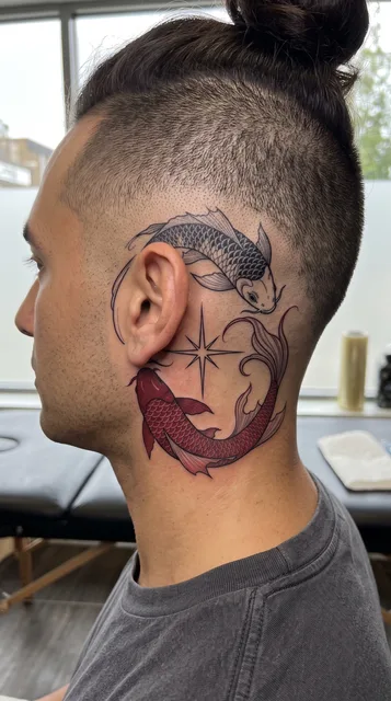 Color Japanese koi fish tattoo behind a man's ear