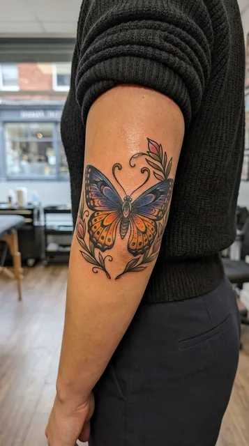 Butterfly tattoo on the elbow