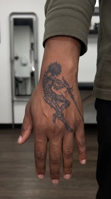 Black and grey dotwork warrior tattoo on the hand