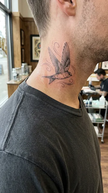 Black and white fine line bird tattoo on a man's neck