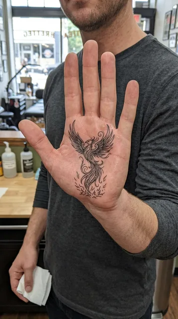 Phoenix tattoo on the palm