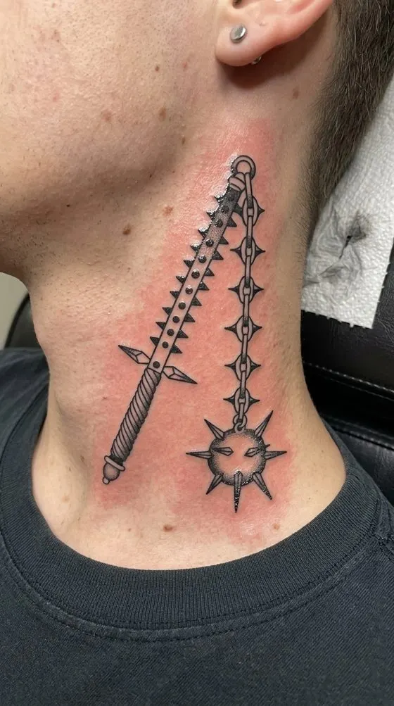 Crossed sword and spiked mace, blackwork tattoo preview on the side of a neck